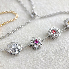 Personalisiertes Drehbares Geburtsblumen Armband mit Geburtssteinen – 1–9 Blumen wählbar, spielbarer Schmuck Geschenk für Sie